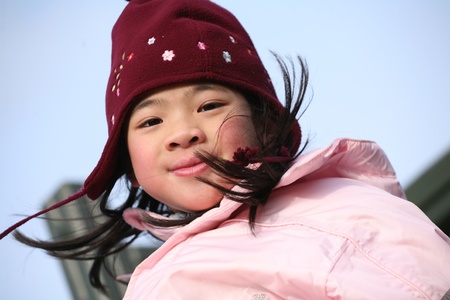  close up of chinese  child head with hat