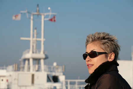 woman outdoor on a ferry deckの写真素材