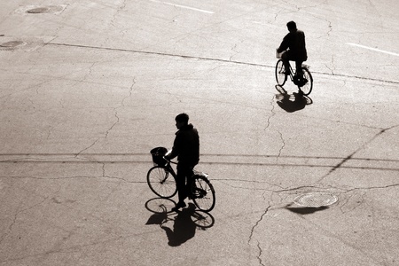 Biking on a street in bejing chinaの写真素材