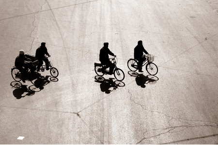 Biking on a street in bejing chinaの写真素材