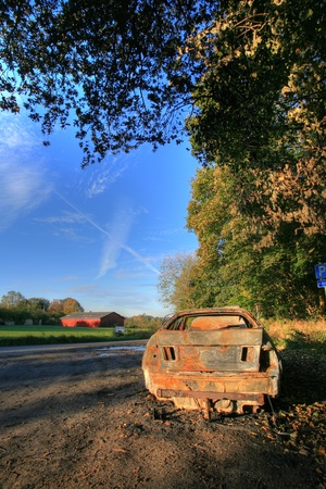 close up burned car on a parking in denmarkの写真素材