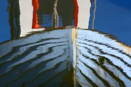 fishing boat reflexions in denmarkの写真素材