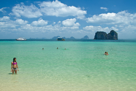 Girl in the water at the beach of the Koh Ngai island Thailandの写真素材