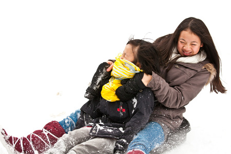 Girl sledging in winter in Denmarkの写真素材