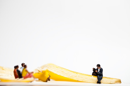 Miniature people in action in various situationsの写真素材