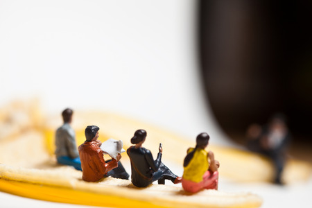 Miniature people in action in various situationsの写真素材