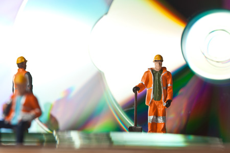 Miniature people in action in various situations