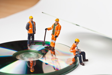 Miniature people in action in various situationsの写真素材