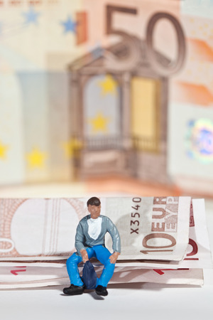 Miniature people in action in various situationsの写真素材