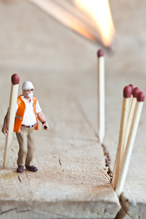 Miniature people in action in various situationsの写真素材