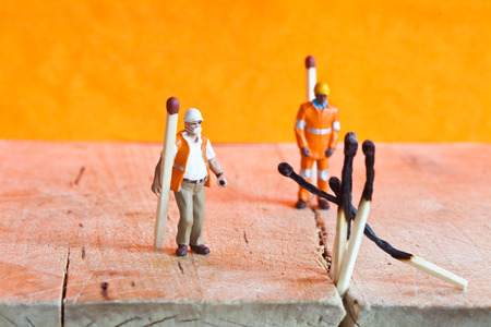 Miniature people in action in various situationsの写真素材