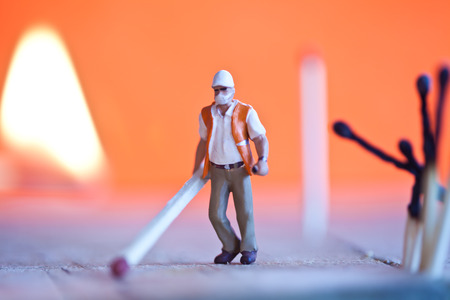 Miniature people in action in various situationsの写真素材