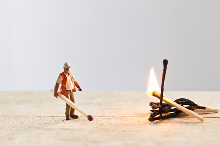 Miniature people in action in various situationsの写真素材