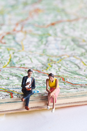 Miniature people in action in various situations