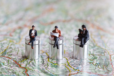 Miniature people in action in various situations