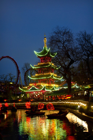 Christmas at the Tivoli in Copenhagen at night. The chinese temple illuminatedのeditorial素材