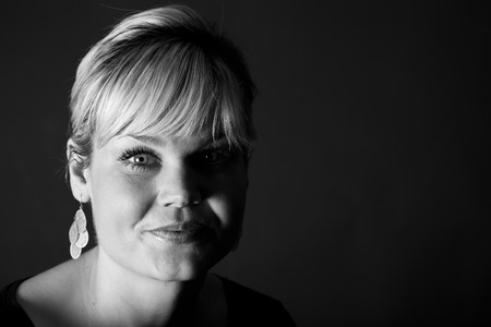 Studio portrait of a cute blond girlの写真素材