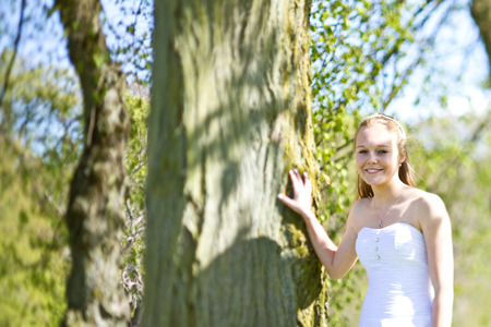 Girl the day of the confirmation in spring in denmark. Shot with a tilt and shift lenseの写真素材