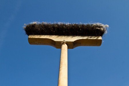 Broom against a dark blue sky