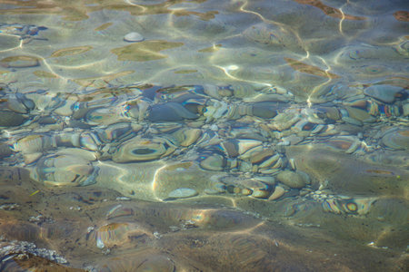 Rocks at the beach in Algajola Village or town in  Corsica in the Balagne area in the summer