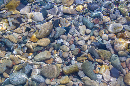 Rocks at the beach in Algajola Village or town in  Corsica in the Balagne arean the summerの写真素材