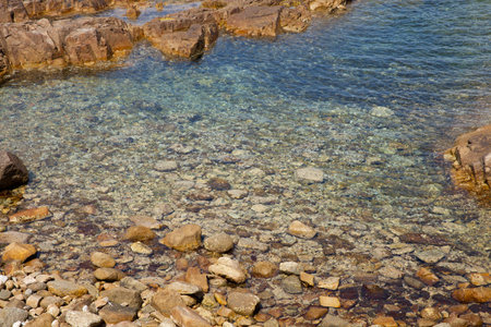 Beach in Algajola Village or town in  Corsica in the Balagne area in the summerの写真素材