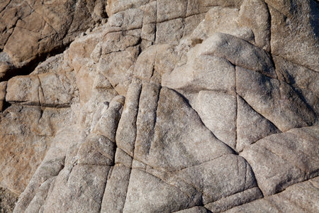 Rocks at the beach in Algajola Village or town in  Corsica in the Balagne arean the summer