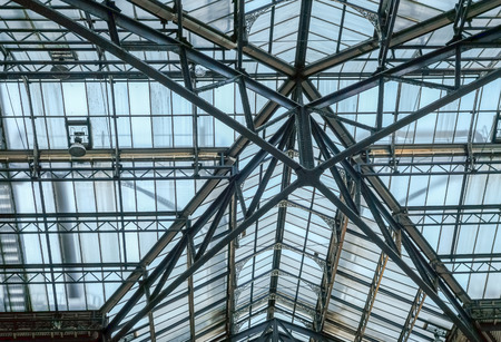 Metal and glass roof, looking upwardsの写真素材