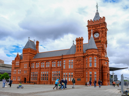 Cardiff Bay, Cardiff, Wales - May 20, 2017: Pierhead builiding with people walking around the square.のeditorial素材