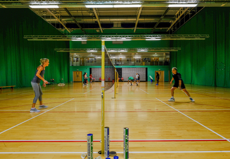 Redbridge, Essex - June 6, 2017:  Social badminton at the sport's centre in Redbridge with players on court.のeditorial素材