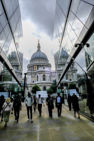 London, UK - August 3, 2017:  St. Paul's Cathederal view from the top of 1 New Change.  Shows people walking in and out of the shopping centre in the foreground.のeditorial素材