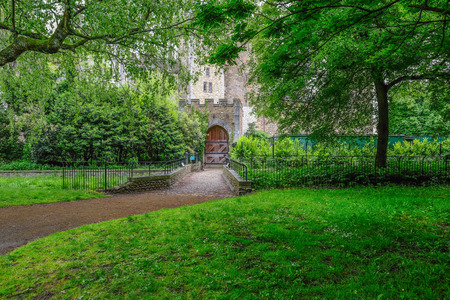 Entrance to the castle in Cardiff, within Bute Park.  Tranquil shot with lots of foliage on the trees.のeditorial素材