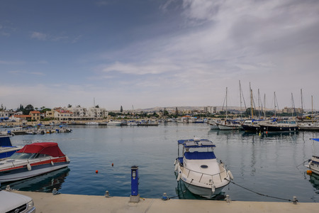 Zygi, Cyprus - June 16, 2018:Boats and yachts moored in the harbour in Zygi.  View shows the village...