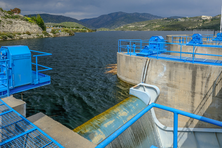 View from the sluice gate at Germasogeia dam looking towards the reservoir and mountains.  Reservoir is full due to heavy rainfall.の写真素材