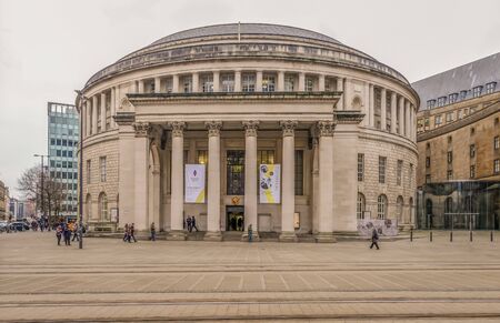 Picadilly, Manchester, UK - January 19, 2019: Central Library iconic round building with people walking around the area.のeditorial素材