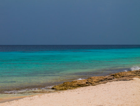 Tropical beach with turquoise water and white sand in CuraÃ§aoの写真素材