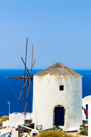 Windmill of Oia village on Santorini island, Greeceの写真素材