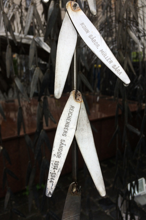 BUDAPEST, HUNGARY - MAY 21, 2015: Silver medals with the names of the victims of Holocaust. Emanuel TreeÂ Holocaust Memorial (also known as theÂ TreeÂ of Life) in theÂ garden of Dohany StreetÂ Synagogueのeditorial素材