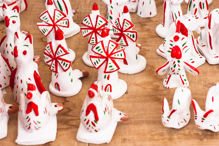 SINEU, MAJORCA, SPAIN - OCTOBER 18, 2017: Siurells, typical Majorcan hand painted clay figures with a whistle at Sineu marketの写真素材