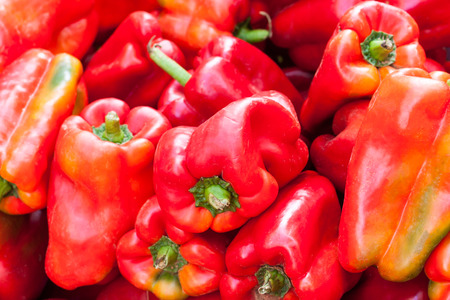 Background of red bell peppers (also known as sweet peppers or capsicum). Sineu market, Majorca, Spainの写真素材