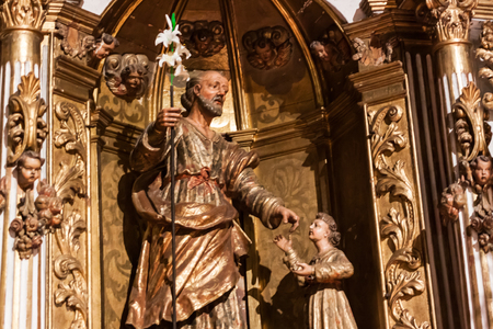 LLUC, MAJORCA, SPAIN - OCTOBER 18, 2017: Statue of Saint Anthony of Padua also known as Anthony of Lisbon with a white lily stalk representing his purity at Santuari de Llucのeditorial素材