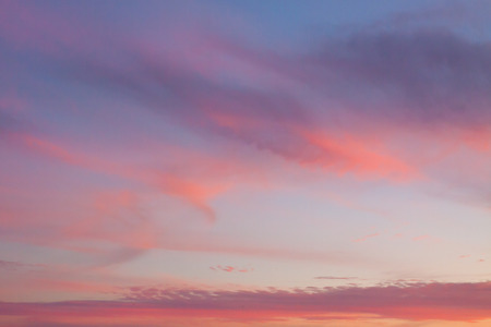 Dramatic sky with colorful clouds at sunsetの写真素材
