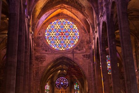 PALMA, MALLORCA, SPAIN - JUNE 23, 2018: Rose window in the Cathedral of Santa Maria of Palma, also...