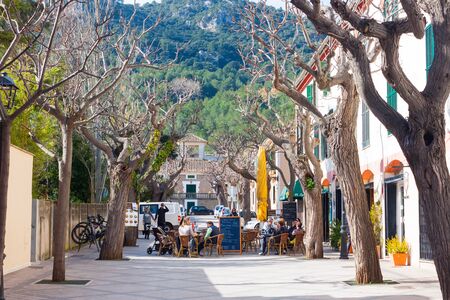 ESPORLES, SPAIN - FEBRUARY 17, 2018: People sitting on the terrace of the bar in Esporles, Mallorca, Spainのeditorial素材