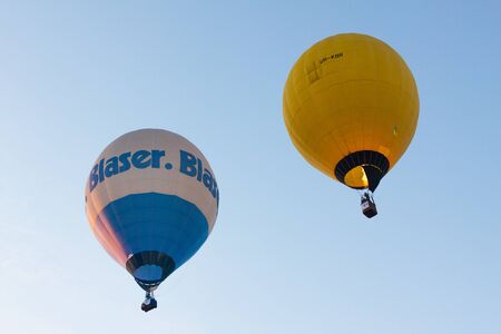 Manacor, Mallorca, Spain - October 27, 2019:  FAI European Hot Air Balloon Championship in Spain. A pair of balloons in flightのeditorial素材
