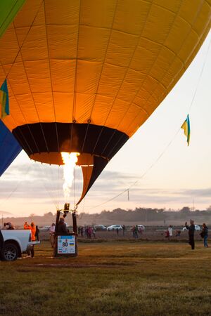 Manacor, Mallorca, Spain - October 27, 2019:  FAI European Hot Air Balloon Championship in Spain. Heating up the air inside the balloon with a burnerのeditorial素材