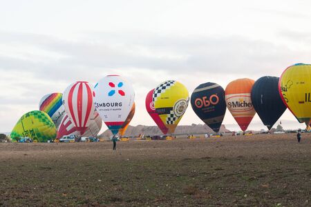 Manacor, Mallorca, Spain - October 27, 2019:  FAI European Hot Air Balloon Championship in Spain. Balloons rising up in the airのeditorial素材