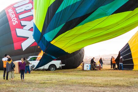 Manacor, Mallorca, Spain - October 27, 2019:  FAI European Hot Air Balloon Championship in Spain. Heating up the air inside the balloon with a burnerのeditorial素材