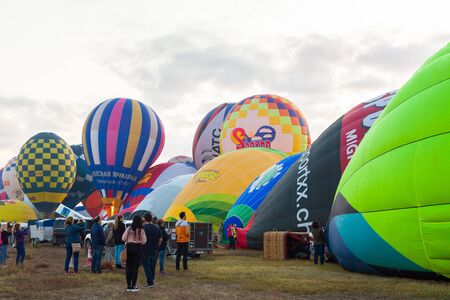 Manacor, Mallorca, Spain - October 27, 2019:  FAI European Hot Air Balloon Championship in Spain. Balloons during inflation on the groundのeditorial素材