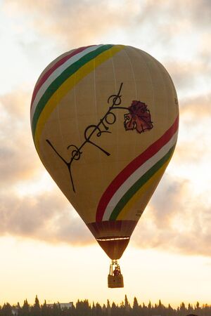 Manacor, Mallorca, Spain - October 27, 2019:  FAI European Hot Air Balloon Championship in Spain. Balloon rising up in the airのeditorial素材